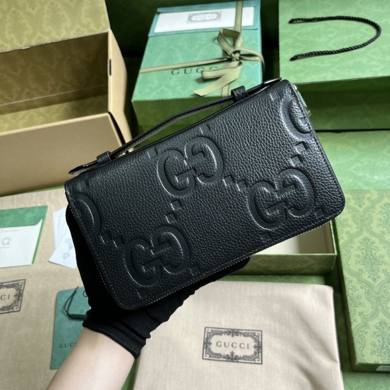 G*u*i clutch bags